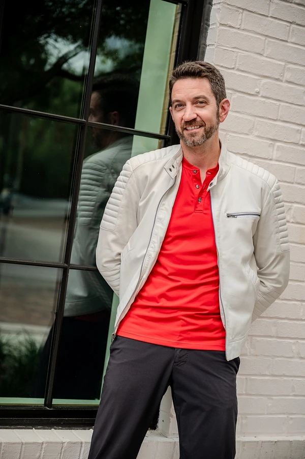 Jeff Grider in a red shirt and silver jacket